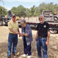 Bob and Connie Kroeker sell a Holt tractor and give the proceeds to Tabor College