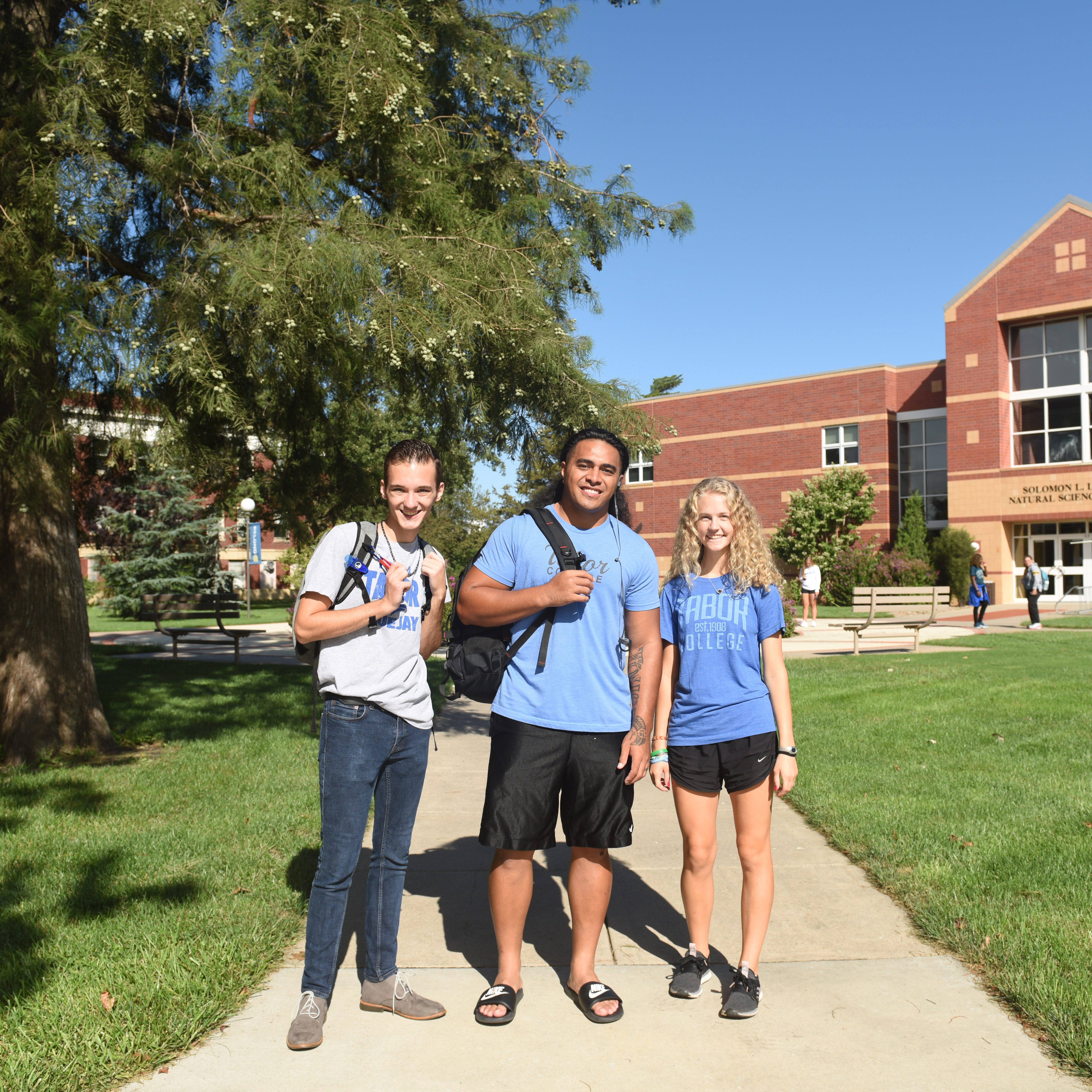 Students pose on campus
