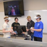 Professor and students using VR technology