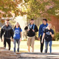 students walking by library on Tabor campus