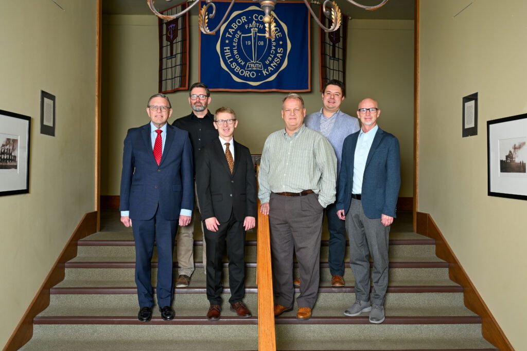 Tabor administrators pose for a photo of a new Graduate in Ministry course